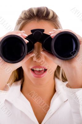 young businesswoman looking through binocular