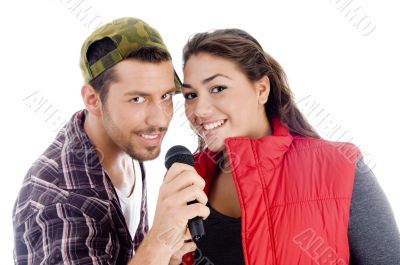 young male and female singer with microphone young male and female singer with microphone