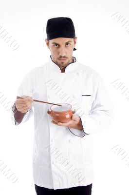 professional chef holding bowl and chopstick