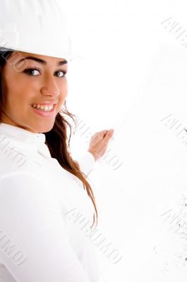 smiling cute female engineer holding blue prints