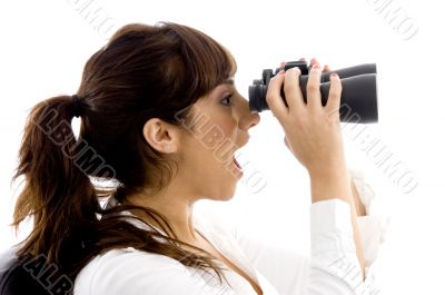 shocked female viewing through binoculars