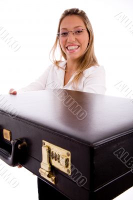 side view of smiling lawyer showing briefcase