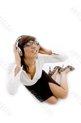high angle view of female attorney tuned to music