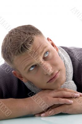 laying handsome male looking aside laying handsome male looking aside