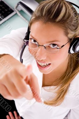 top view of smiling service provider pointing up top view of smiling service provider pointing up