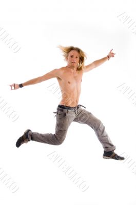 shirtless male jumping in air