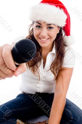 model wearing christmas hat and showing microphone