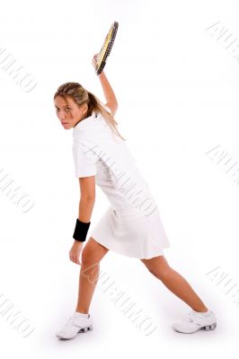 side view of tennis player ready to hit the ball