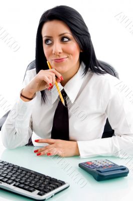 female thinking and holding pencil