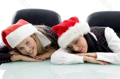 young colleagues wearing christmas hat