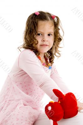 adorable girl posing with her toy