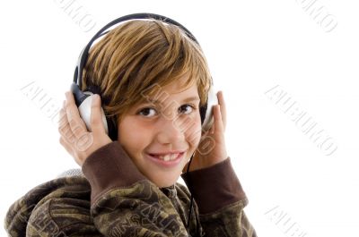 portrait of smiling child enjoying music