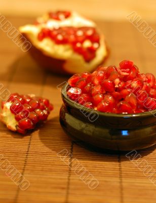 broken ripe pomegranate fruit and seeds