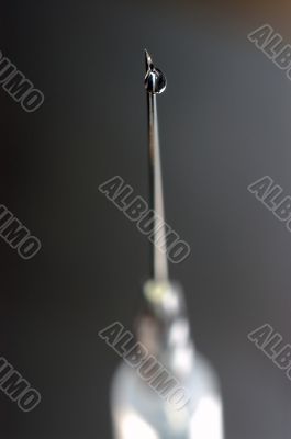 syringe close-up, focus on the drop syringe close-up, focus on the drop