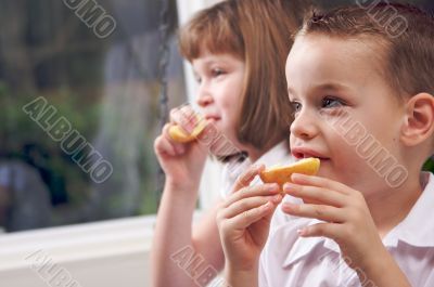 Sister and Brother Eating an Apple