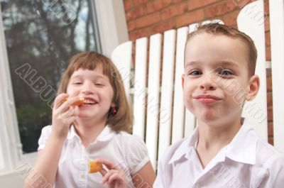 Sister and Brother Eating an Apple