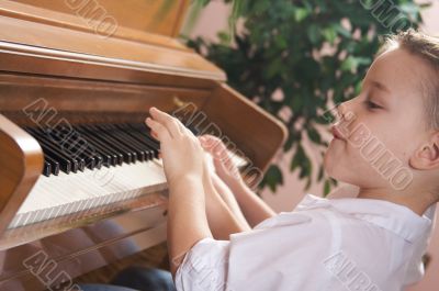 Children Playing the Piano