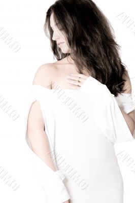 brunette in white shirt on white background high key looking asi