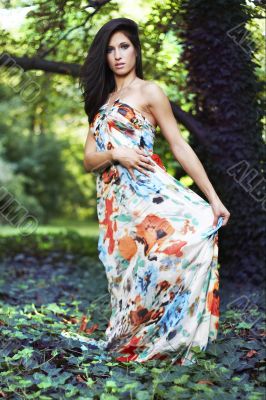 beautiful girl standing on ivy