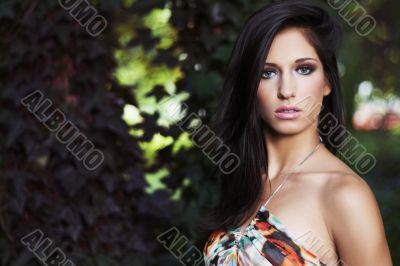 beautiful girl standing on ivy