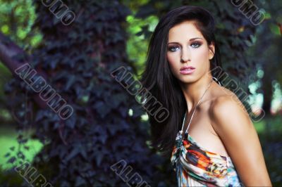 beautiful girl standing on ivy