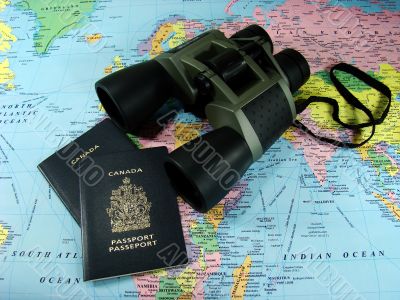Binoculars, map and travel passports