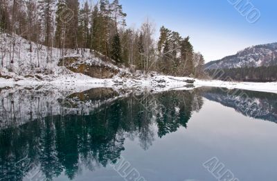 Blue warm nonfreezing lake in Mountain Altai.