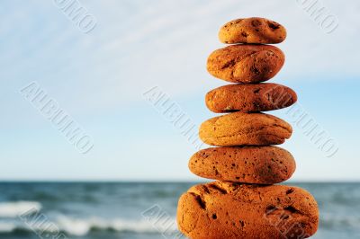 Red stone tower on a beach