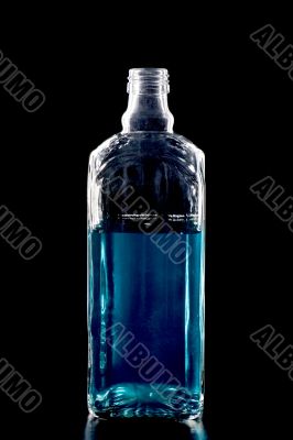 Colored Bottle with liquid on black