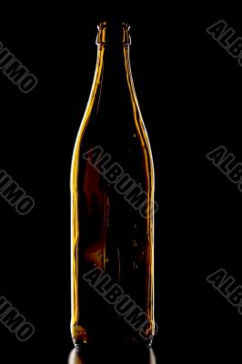 Empty beer bottle on black