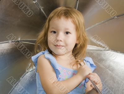 Small pretty girl with umbrella
