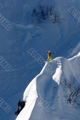 snowboarder ride on high mountain