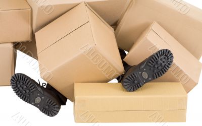 Male feet and heap of boxes