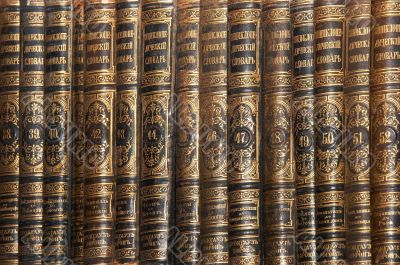 Row of old books cover spines Row of old books cover spines