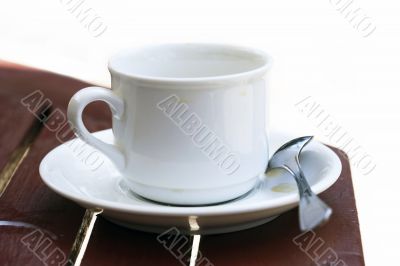 White cup and spoon White cup and spoon