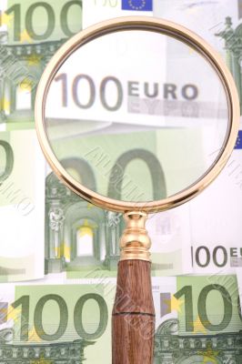 magnifying glass with money macro