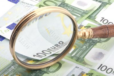 magnifying glass with money
