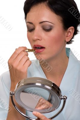 Applying lipstick