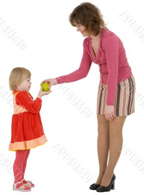 Women give apple to the girl