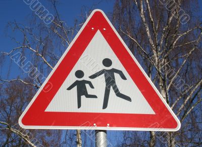 Warning sign near a children`s playground