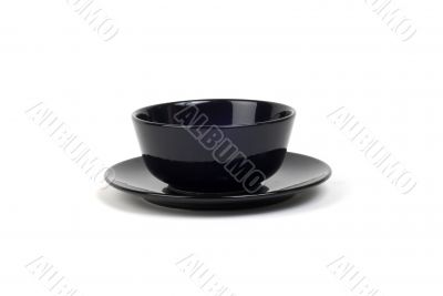 Black bowl on plate