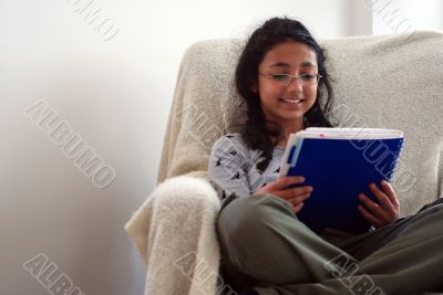 cute child reading notebook