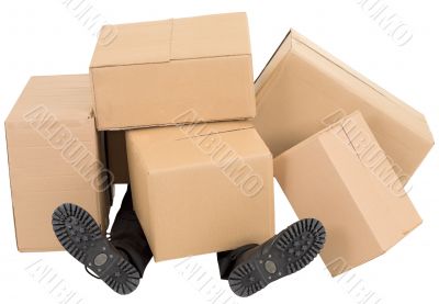 Male feet under a heap of boxes