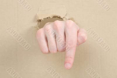 Gesture male hand through cardboard