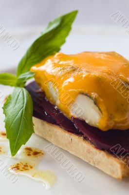 Smoked Haddock On A Bed Of Beet-root With Melted Blue Cheese