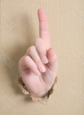 Gesture male hand through cardboard