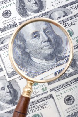 magnifier with dollar closeup