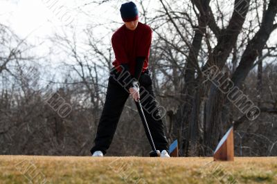 youth golfer tee shot set up