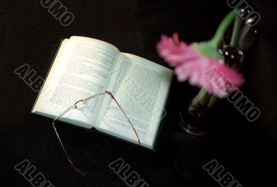Open book and glasses Open book and glasses