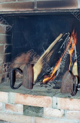 Two old irons in fireplace Two old irons in fireplace